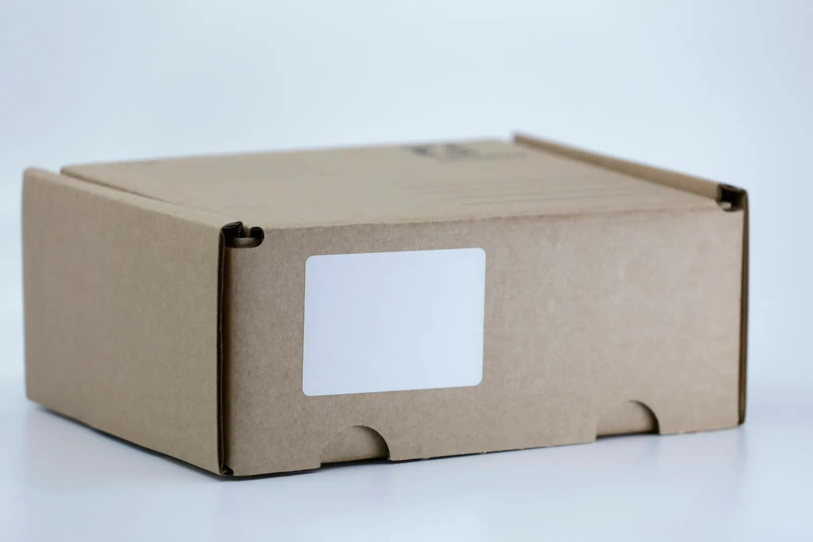 Cardboard shipping box on a white table